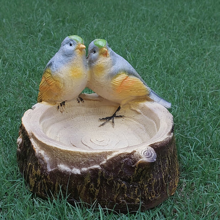 bird feeding statue handcrafted