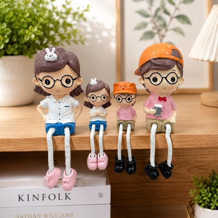 PCTKART Cute Family Sitting Figurines with Hanging Legs | Polyresin Home Decor Showpiece for Living Room, Bedroom & Office (Set of 4) - Pctkart