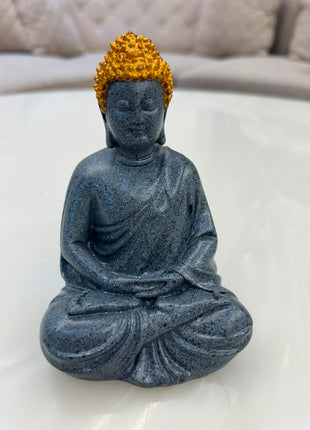 ark grey meditating Buddha statue with golden headpiece for home décor
