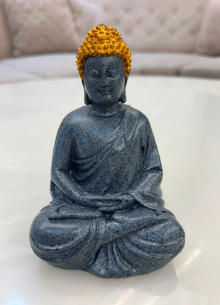 ark grey meditating Buddha statue with golden headpiece for home décor